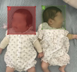 A photo of my two girls with annotations. It will be used for building the face recognition dataset. In the blog post, their faces have been blurred for anonymization.